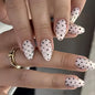 Fall Short Press On Nails Almond, Nude Fake Nails accented with golden glitter and Graceful White Floral Petal Design, Glossy Gel Finish Acrylic Nails, Natural Reusable Glue On Nails for Women