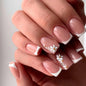 Fall Short Press On Nails Almond, Nude Fake Nails accented with golden glitter and Graceful White Floral Petal Design, Glossy Gel Finish Acrylic Nails, Natural Reusable Glue On Nails for Women
