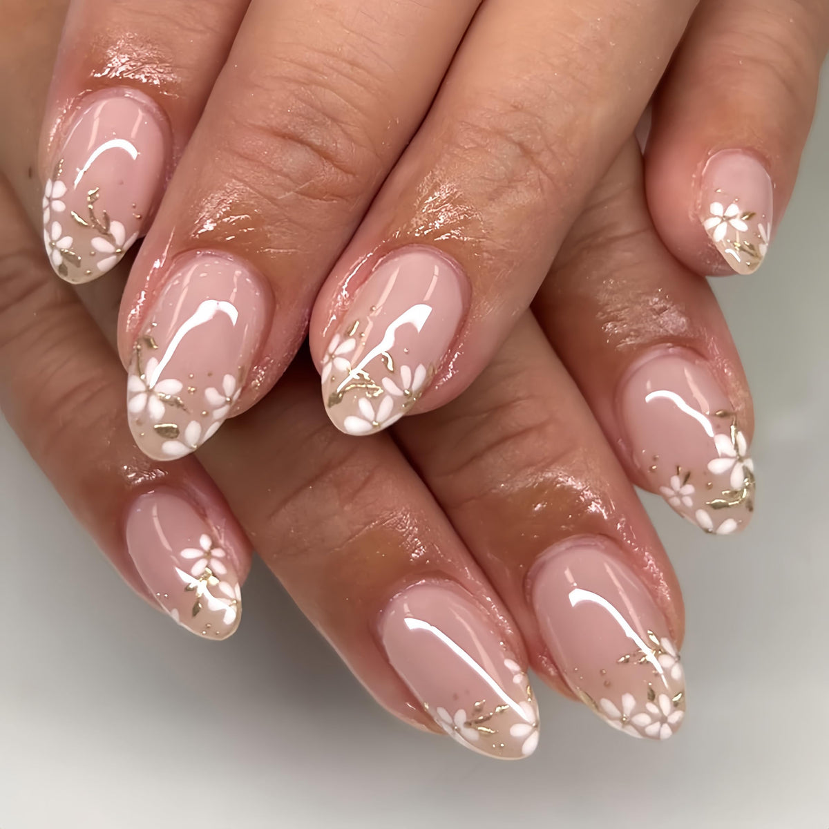 Fall Short Press On Nails Almond, Nude Fake Nails accented with golden glitter and Graceful White Floral Petal Design, Glossy Gel Finish Acrylic Nails, Natural Reusable Glue On Nails for Women