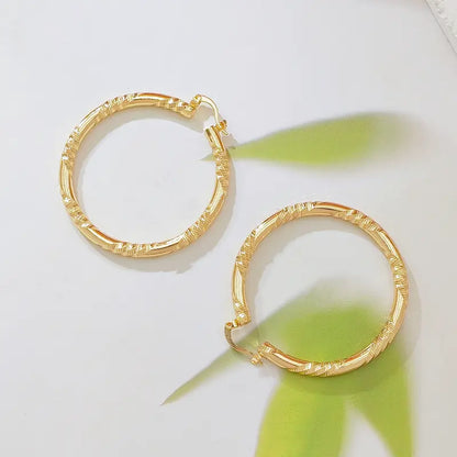 Women's Elegant Twisted Gold Shiny Huggie Earrings - Faceted Diamond-Cut Textured, Lightweight Comfortable Female Costume Jewelry, Earrings for Women for Party & Daily Wear, Gold Shiny Earrings